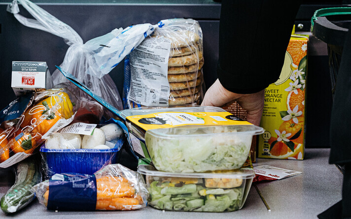 Food items at a supermarket checkout.