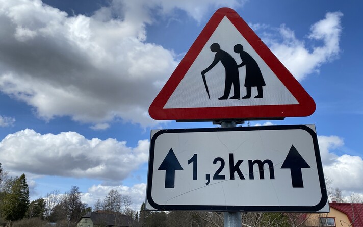 Road sign warning of a care home ahead.
