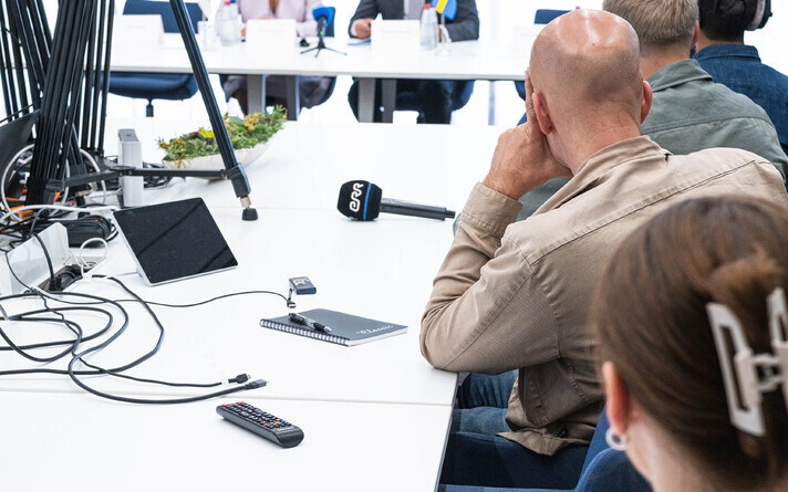 Journalists at a press conference.