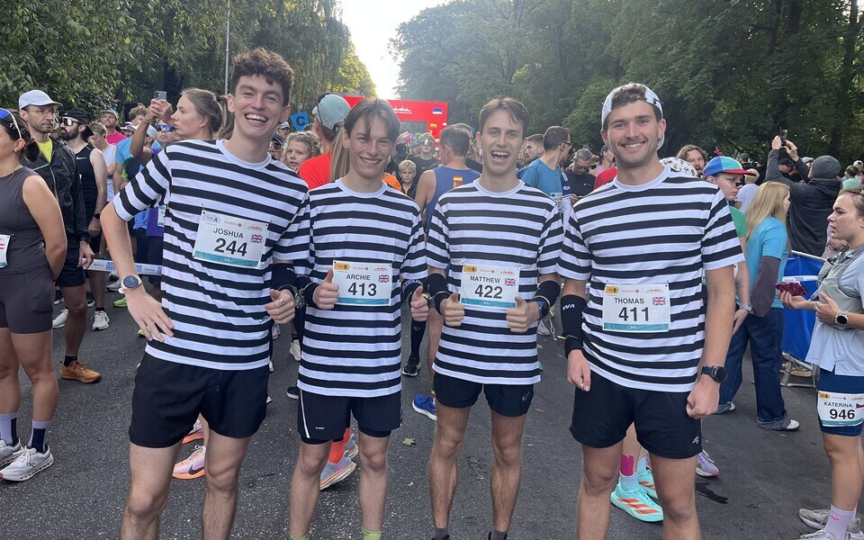 The four Englishman had little choice in finishing the half marathon with exactly the same time - just under 90 minutes - as they were all running handcuffed together.