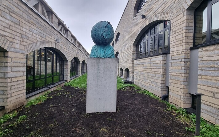 The cabbage-head bust at National Library yard.